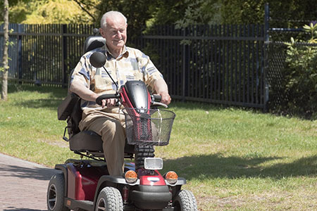 elderly man on electric wheelchair